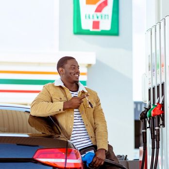 7-Eleven - a man filling up his car at a gas station - Convenience Stores Near Me - Bakersfield, California