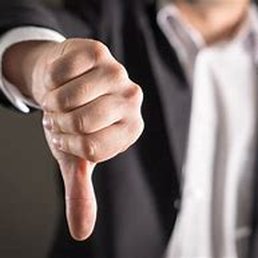 a man in a suit pointing at the camera a man in a suit pointing at the camera