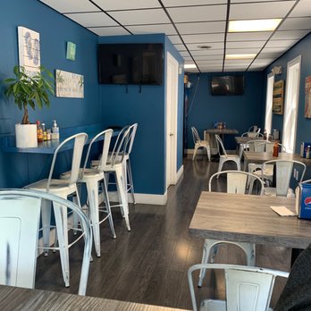 Baja Cocina - Better view of seating area with napkins and hot sauces on each table - New Mexican Cuisine Near Me - Ridgefield, Connecticut