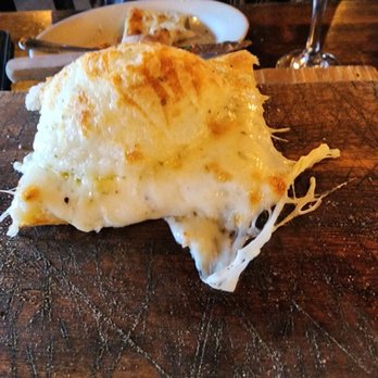 Wood & Fire - Garlic & Cheese Flat Bread with a big bubble - Pizza Near Me - Delray Beach, Florida Wood & Fire - Garlic & Cheese Flat Bread with a big bubble - Pizza Near Me - Delray Beach, Florida
