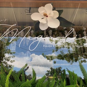 Magnolia Wine Garden - the reflection of a flower in the window - Wine Bars Near Me - Eustis, Florida