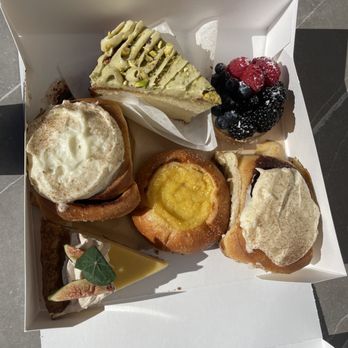 Helms Bakery - Start at top middle: pistachio olive oil cake, fruit tart, cinnamon roll, lemon brioche, corn honey pie, and yes--another cinnamon roll! - Bakeries Near Me - Los Angeles, California Helms Bakery - Start at top middle: pistachio olive oil cake, fruit tart, cinnamon roll, lemon brioche, corn honey pie, and yes--another cinnamon roll! - Bakeries Near Me - Los Angeles, California