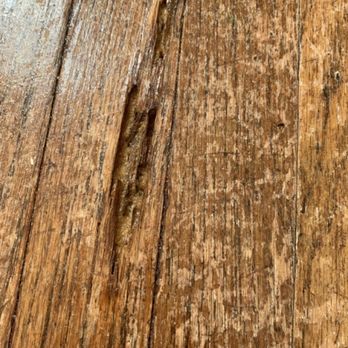 Evolution Flooring - Before pic 1: cracked flooring - Flooring Near Me