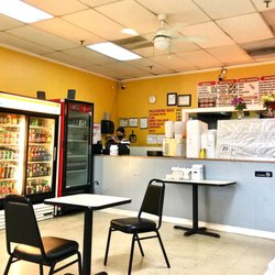 Latino Pollo A La Brasa - Inside restaurant, Cashier Lali at the counter ready to take your orders with a smile!  Menu prices have changed.