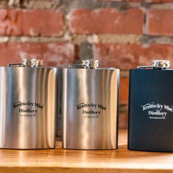 Kentucky Mist Moonshine - three flasks on a table - Bars Near Me - Whitesburg, Kentucky Kentucky Mist Moonshine - three flasks on a table - Bars Near Me - Whitesburg, Kentucky