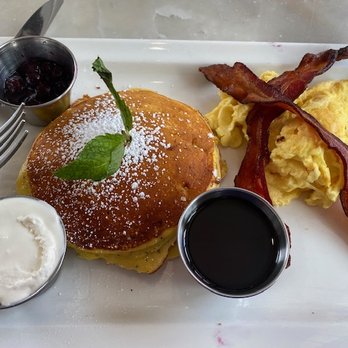 Jeannine's Bakery & Restaurant - Lemon Poppyseed pancakes with Ginger Blueberry Sauce & Whipped Greek Yogurt. This comes with 2 eggs & bacon, sausage, or ham. Amazing! - Bakeries Near Me - Montecito, California Jeannine's Bakery & Restaurant - Lemon Poppyseed pancakes with Ginger Blueberry Sauce & Whipped Greek Yogurt. This comes with 2 eggs & bacon, sausage, or ham. Amazing! - Bakeries Near Me - Montecito, California