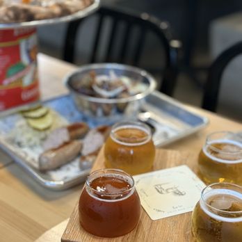 Ponysaurus Brewing Co - beer flight, brat platter, Fall Tarte Flambee - Breweries Near Me - Raleigh, North Carolina Ponysaurus Brewing Co - beer flight, brat platter, Fall Tarte Flambee - Breweries Near Me - Raleigh, North Carolina
