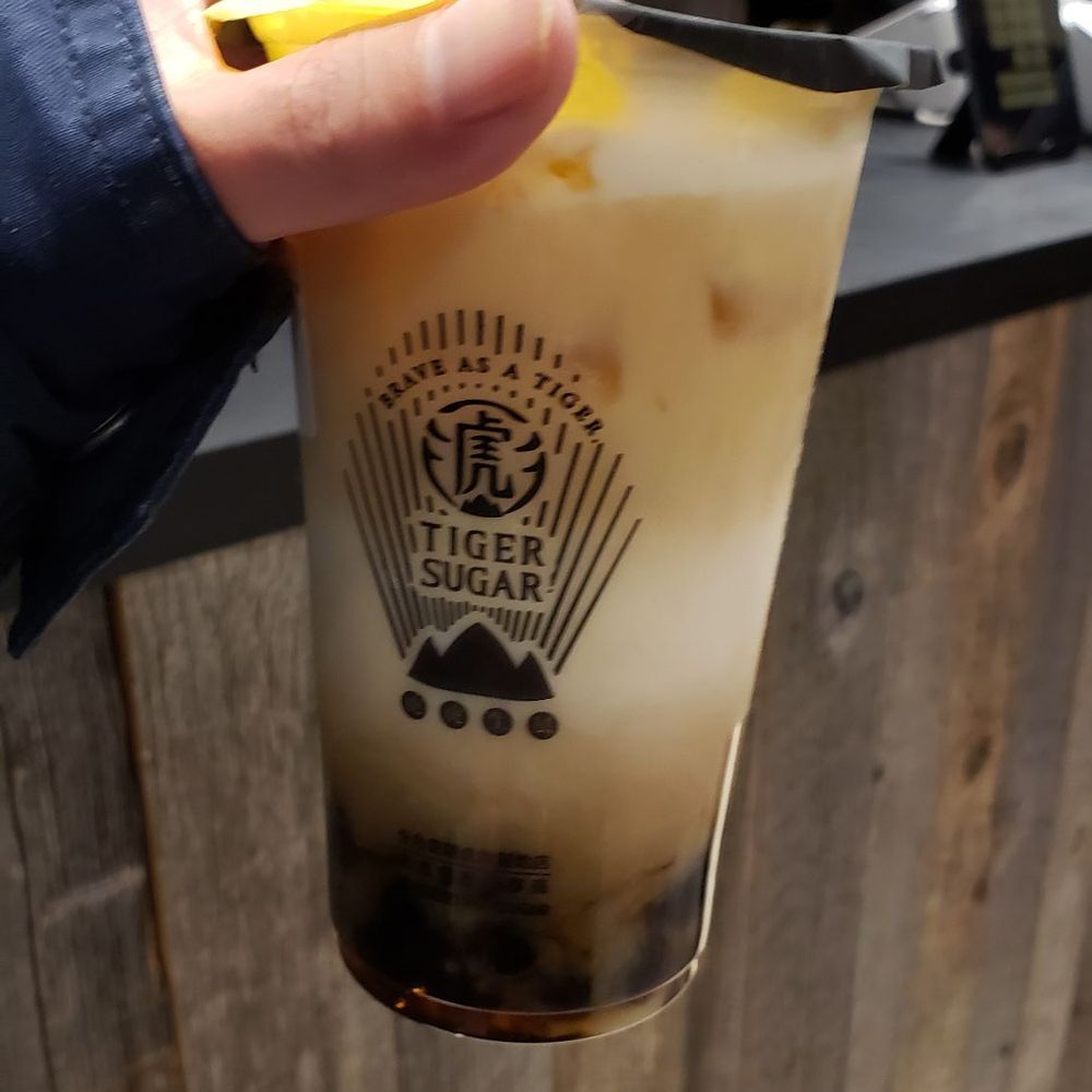 Green tea latte with mousse and boba Green tea latte with mousse and boba