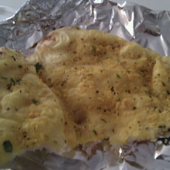 India Bistro - "Garlic naan" with strange neon-yellow bits. Not like any other garlic naan I've ever had, thank god. - Indian Near Me - Vancouver, British Columbia India Bistro - "Garlic naan" with strange neon-yellow bits. Not like any other garlic naan I've ever had, thank god. - Indian Near Me - Vancouver, British Columbia