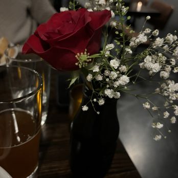 Ember Wood Fired Grill - a red rose in a black vase - Whiskey Bars Near Me - Dover, New Hampshire