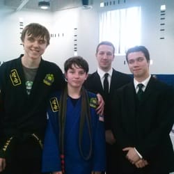 Black Belt Academy - My son with his instructors after his black belt test they were all there to support him