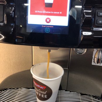 RaceTrac - a cup of coffee being poured into a coffee machine - Gas Stations Near Me - Orlando, Florida RaceTrac - a cup of coffee being poured into a coffee machine - Gas Stations Near Me - Orlando, Florida
