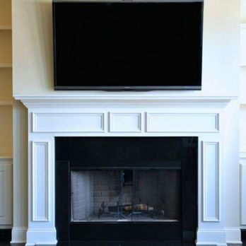 Excellent Electrical Contractors - TV mounted over fireplace custom wire concealment - Electricians Near Me Excellent Electrical Contractors - TV mounted over fireplace custom wire concealment - Electricians Near Me