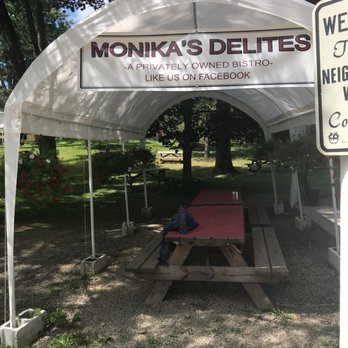 Monika's Delites - a picnic table under a tent - Delis Near Me Monika's Delites - a picnic table under a tent - Delis Near Me