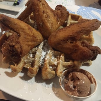 Dame's Chicken & Waffles - The classic waffle, 3 wings, caramel cashew drizzle on side, with the chocolate hazelnut shmear! Amazing. - Southern Near Me - Durham, North Carolina