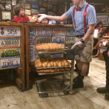 Lambert's Cafe - He is the waiter that throws the rolls at you. For little kids, he hands them the roll. - Seafood Near Me - Foley, Alabama Lambert's Cafe - He is the waiter that throws the rolls at you. For little kids, he hands them the roll. - Seafood Near Me - Foley, Alabama