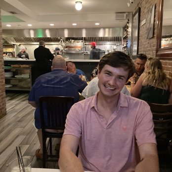 Monica's Trattoria - Kitchen in the background. - Italian Near Me - Boston, Massachusetts