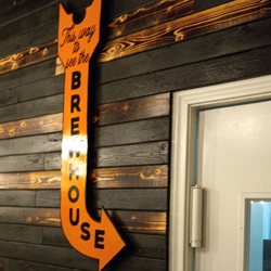 Mija Barbecue - To unisex restrooms and view of brewery