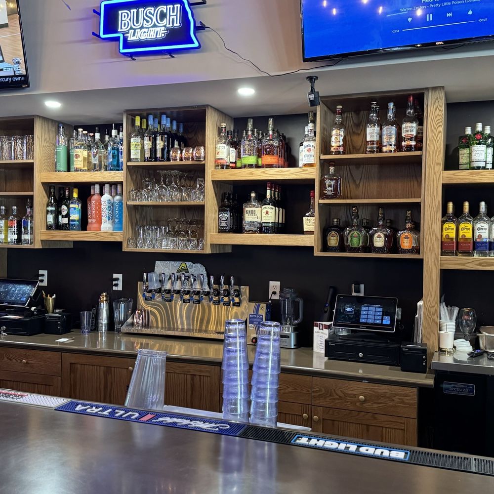 Good Life - a bar with a lot of bottles of alcohol - Seafood Near Me - Gothenburg, Nebraska
