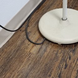 Fast Pace Health Urgent Care - Collection of dust and dirt on exam equipment and floor