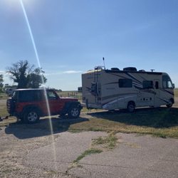Circle K Campground - Parking spot. No shade but full hookups and nice combo bath and shower. Don't expect any services in White Lake on a Sunday.
