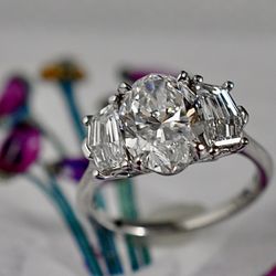 Tree stone platinum engagement ring with natural diamonds