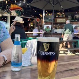 Outdoor patio with a pint of black & tan Outdoor patio with a pint of black & tan