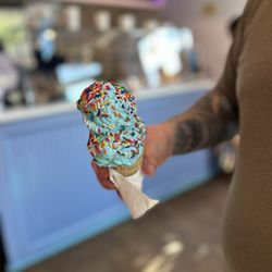 Bmore Licks - Double scoop of cotton candy on a waffle cone with sprinkles