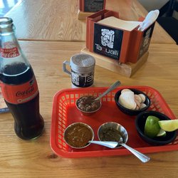 Taqualli - Salsa plate: Hot Salsa (Lower Left), Red Mild Salsa (Upper Middle), and Green Mild Salsa (Lower Right), including limes and radishes.