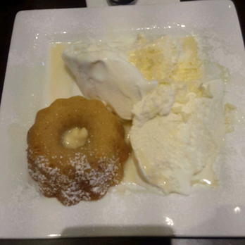 D Spot Dessert Cafe - White chocolate lava cake with ice cream and white chocolate curls on the side. - Desserts Near Me - Toronto, Ontario