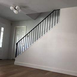 Got rid of old/dated ornate wood railing and replaced with powder coated metal!