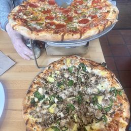 Custom medium pizza (bottom) and Mini-Super medium pizza (top)