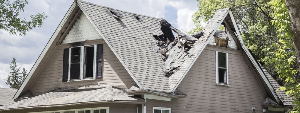 Slide of TM Roofing & Construction Group