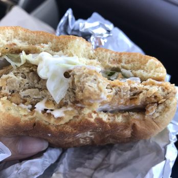 KFC - a person holding a sandwich in their hand - Fast Food Near Me - London, Ontario