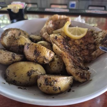 Hungry Palate Bar & Grill - Pork Chops and Roasted Yellow Potatoes. I wasn't disappointed the pork chops cookes perfectly and the potatoes soft and delicious. - American Near Me - Winston-Salem, North Carolina