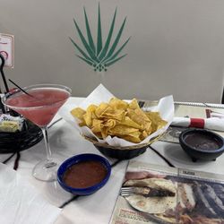 Cosmo, chips, salsa and black been dip