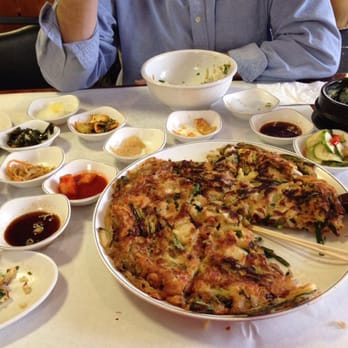 Seoul Garden - Seafood pancake, all side dishes that come with your meal. The steamed egg was awesome. Everything was outstanding! - Korean Near Me - Parma, Ohio Seoul Garden - Seafood pancake, all side dishes that come with your meal. The steamed egg was awesome. Everything was outstanding! - Korean Near Me - Parma, Ohio