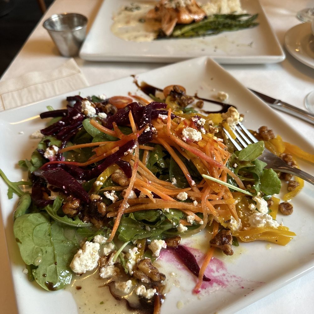 a plate of salad on a table a plate of salad on a table