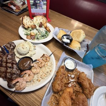 Logan's Roadhouse - New York Strip with shrimp, Cesar salad - Steakhouses Near Me - Kissimmee, Florida Logan's Roadhouse - New York Strip with shrimp, Cesar salad - Steakhouses Near Me - Kissimmee, Florida