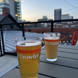 two glasses of beer on a table two glasses of beer on a table