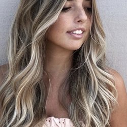 Kecia Heinz Studio - Balayage and baby lights with a root smudge. Long layered haircut and soft beach waves.