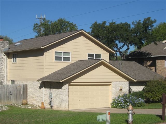 Slide of Travis Roofing Austin