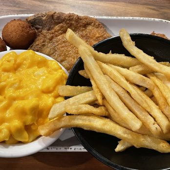 Henry's Restaurant - Fried Pork Chop Platter - $15.99 - comes with 2 sides and 2 hush puppies - American Near Me - Kill Devil Hills, North Carolina