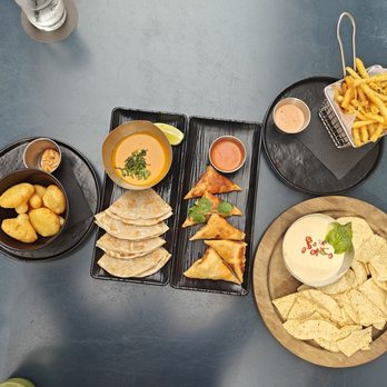 Traveler's Cart - Roti, samosa, queso chips, fries - Cocktail Bars Near Me - Houston, Texas