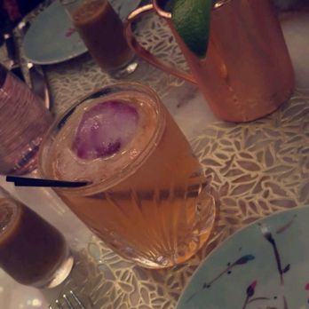 Bloom & Bee - Moscow mule and one of their main drinks with an orchid - New American Near Me - Houston, Texas Bloom & Bee - Moscow mule and one of their main drinks with an orchid - New American Near Me - Houston, Texas