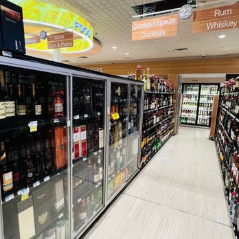 Rite Aid - a grocery store aisle with a variety of bottles of wine - Drugstores Near Me - Highland Park, New Jersey