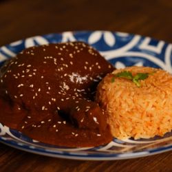 Lobos Latin Cuisine - Chicken mole served with rice.