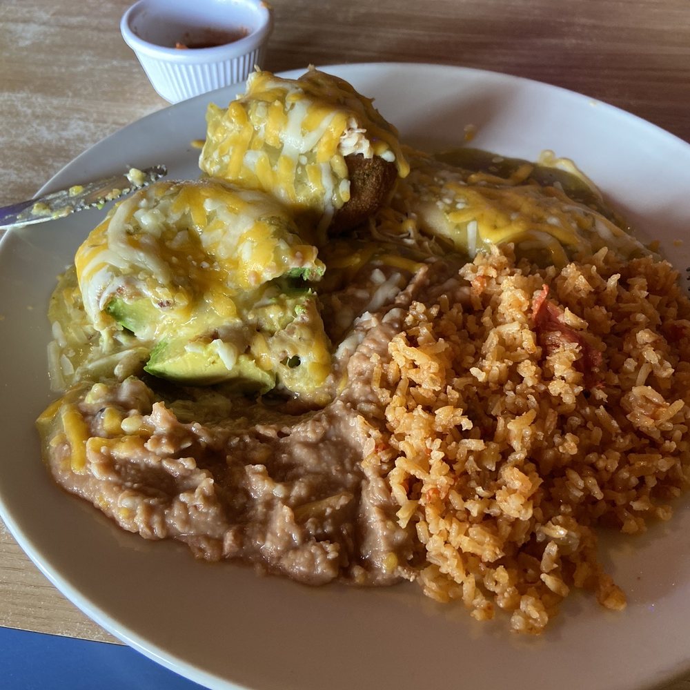 Stuffed avocados, one with cheese, the other with chicken. Stuffed avocados, one with cheese, the other with chicken.