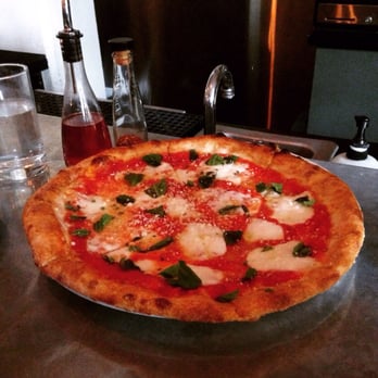 Bar Cotto - The is the margarita pizza and is absolutely delicious. It is cooked perfectly in a stone oven. Yum! - Bars Near Me - Seattle, Washington Bar Cotto - The is the margarita pizza and is absolutely delicious. It is cooked perfectly in a stone oven. Yum! - Bars Near Me - Seattle, Washington