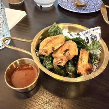 Kin Khao - Driest smallest chicken wings ever. Still in a bowl of basil. Don't order - Thai Near Me - Monrovia, California
